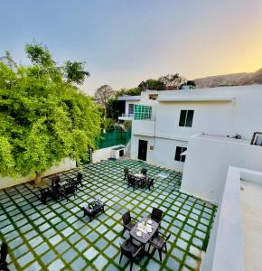 an overhead view of a patio with tables and chairs at Hostel ivory in Jaipur