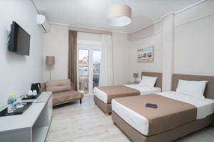 Postel nebo postele na pokoji v ubytování Hotel Alkyon + 37 fotografií