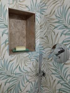 a bathroom with a mirror and a shower at VETULONIA ROMANTICA in Vetulonia