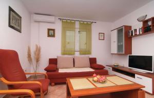 a living room with a couch and a table at Villa panorama uz more na kraju svijeta in Drvenik Veli