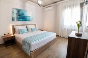 Postel nebo postele na pokoji v ubytování Destino Luxury Apts