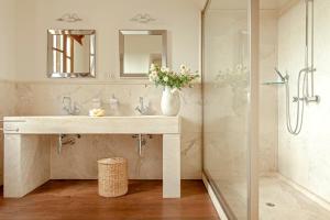a bathroom with a sink and a shower at Villa delle Palme in Cecina +37 photos