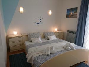 מיטה או מיטות בחדר ב-Apartmani Sonja