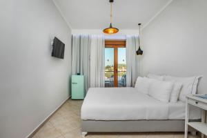 Krevet ili kreveti u jedinici u okviru objekta Hesperides Hotel Pefkochori