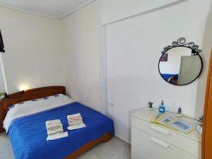 Postel nebo postele na pokoji v ubytování Mpou's House
