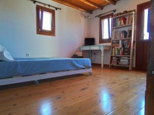 Posteľ alebo postele v izbe v ubytovaní Cycladic House