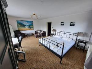 Postel nebo postele na pokoji v ubytování Blue Mountain Hotel