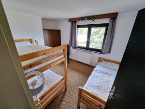 Postel nebo postele na pokoji v ubytování Blue Mountain Hotel