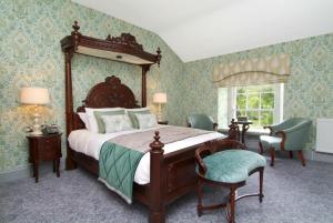 a bedroom with a large bed with a wooden frame at Rockhill House in Letterkenny