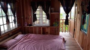 เตียงในห้องที่ Homestay Da Blah