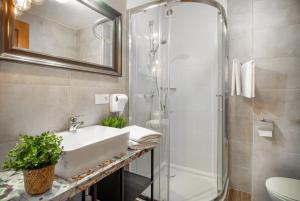 a bathroom with a sink and a shower at Dom Góreckich in Kazimierz Dolny +37 photos