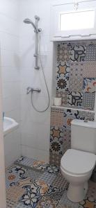 a bathroom with a toilet and a shower at LEO Haute standing appartment S1 center Monastir in Monastir