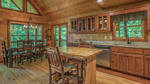 a kitchen with a table and chairs in a cabin at Aska Retreat in Blue Ridge