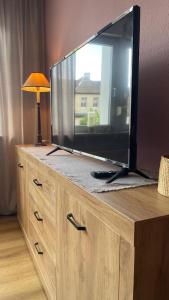 Телевизор и/или развлекательный центр в Ferienwohnung Weitsicht