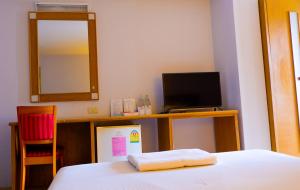 Postel nebo postele na pokoji v ubytování Sweet Home Hotel Betong