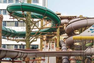 a roller coaster in a park with a slide at Magic Aqua Rock Gardens in Benidorm