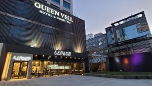 a view of a large building in a city at Queenvell Hotel in Daegu