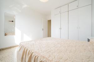 Posteľ alebo postele v izbe v ubytovaní Apartament Esmeralda