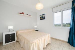 Posteľ alebo postele v izbe v ubytovaní Apartament Esmeralda