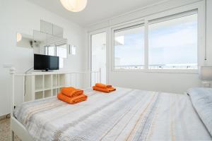 Posteľ alebo postele v izbe v ubytovaní Apartament Esmeralda