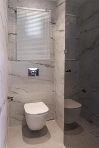 A bathroom at Aqua Blue Suites