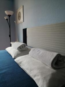 Voodi või voodid majutusasutuse Peniche Blue Wave Home toas
