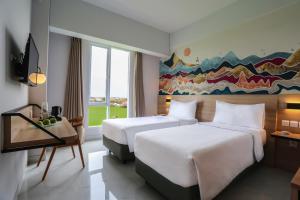 מיטה או מיטות בחדר ב-favehotel Pamanukan