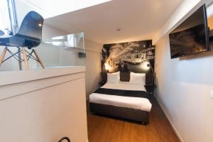 Postel nebo postele na pokoji v ubytování Résidence-Hotel Le Quinze Grand Place Brussels