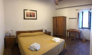 Posteľ alebo postele v izbe v ubytovaní Agriturismo Diffuso Monte Oliveto Maggiore