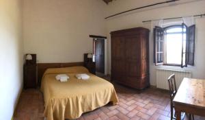 Posteľ alebo postele v izbe v ubytovaní Agriturismo Diffuso Monte Oliveto Maggiore