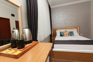 Кровать или кровати в номере Perazre Hotel