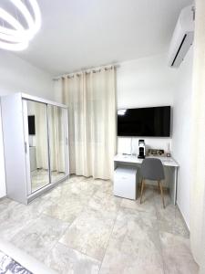 Kuchyň nebo kuchyňský kout v ubytování Circeo Boutique Rooms