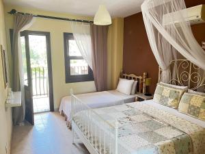 A bed or beds in a room at Han Boutique Hotel