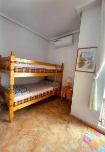 Postel nebo postele na pokoji v ubytování Bungalow muy cerca de la playa