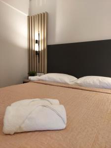 Ein Bett oder Betten in einem Zimmer der Unterkunft EUPHORIA ''Staying in Pleasure''