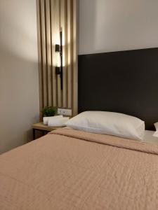 Ein Bett oder Betten in einem Zimmer der Unterkunft EUPHORIA ''Staying in Pleasure''