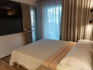 Ein Bett oder Betten in einem Zimmer der Unterkunft EUPHORIA ''Staying in Pleasure''