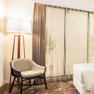 Postel nebo postele na pokoji v ubytování Swiss-Belinn Singkawang