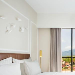 Postel nebo postele na pokoji v ubytování Swiss-Belinn Singkawang + 37 fotografií