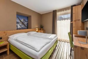 TV a/nebo společenská místnost v ubytování Hotel Vittoria - Ricarica l'anima