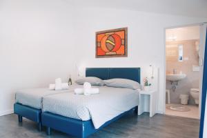 Voodi või voodid majutusasutuse Hotel Aurora & Appartamenti toas