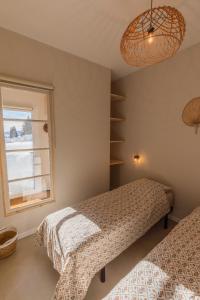 מיטה או מיטות בחדר ב-Studio La Résilience, au pied des pistes à Autrans