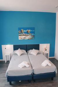 Voodi või voodid majutusasutuse Hotel Aurora & Appartamenti toas