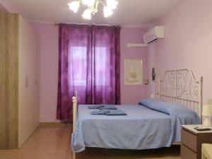 Posteľ alebo postele v izbe v ubytovaní Elisir b&b