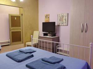 Posteľ alebo postele v izbe v ubytovaní Elisir b&b