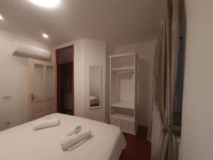 En eller flere senger på et rom på Bernardi Residence