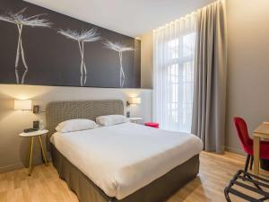 Un ou plusieurs lits dans un hébergement de l'établissement Ibis Styles Toulouse Capitole