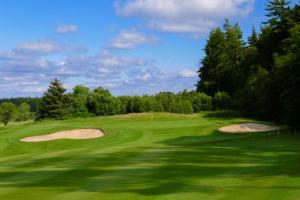 a view of a golf course with two bunker golf greens at Gleddoch Golf & Spa Resort in Langbank