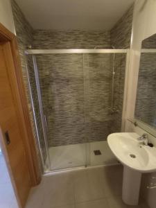 a bathroom with a shower and a sink at Apartment La Isla Terrazas de la Torre I in Roldán