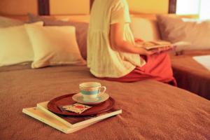 A bed or beds in a room at Temari Inn Oitoma